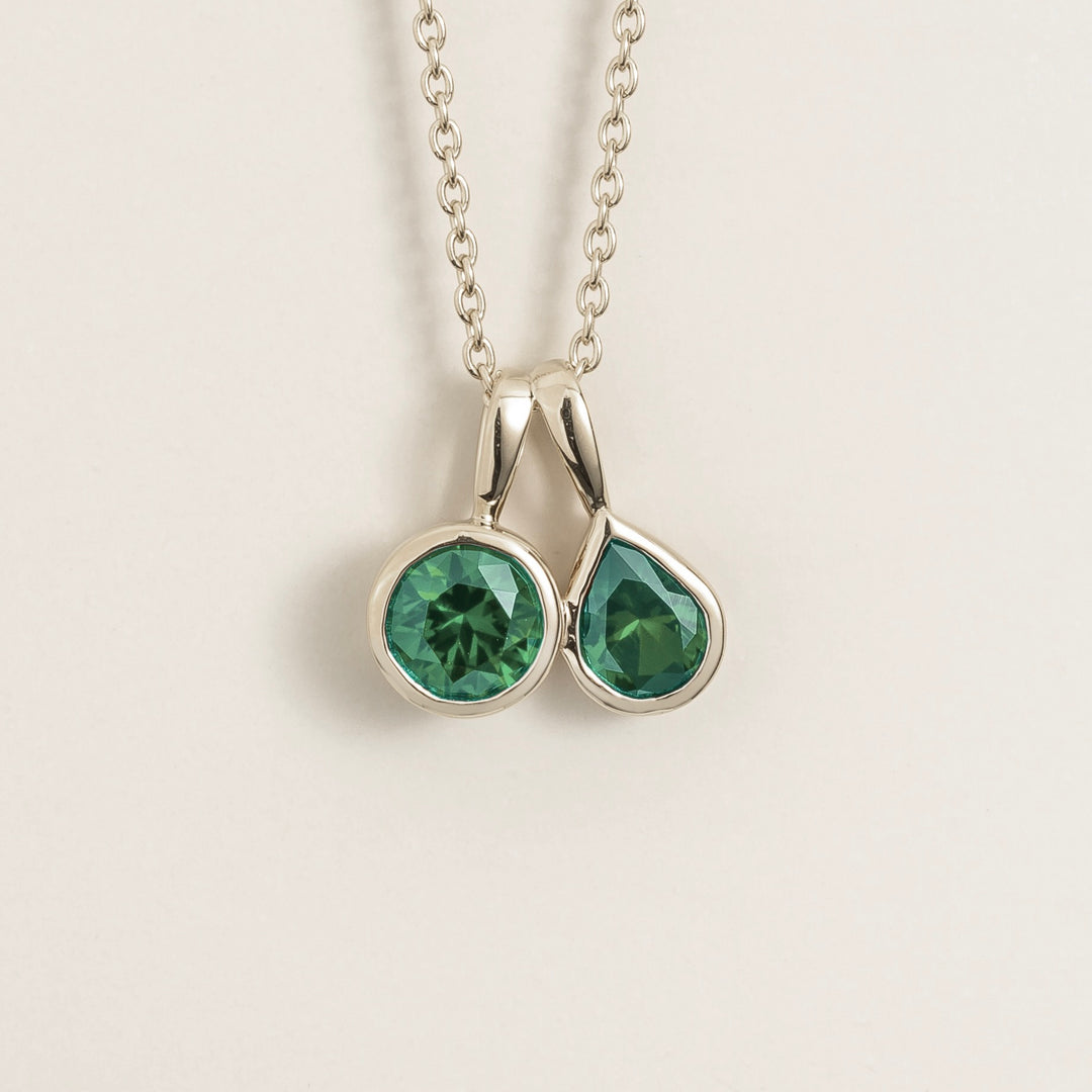 Prunus white gold necklace set with Emerald