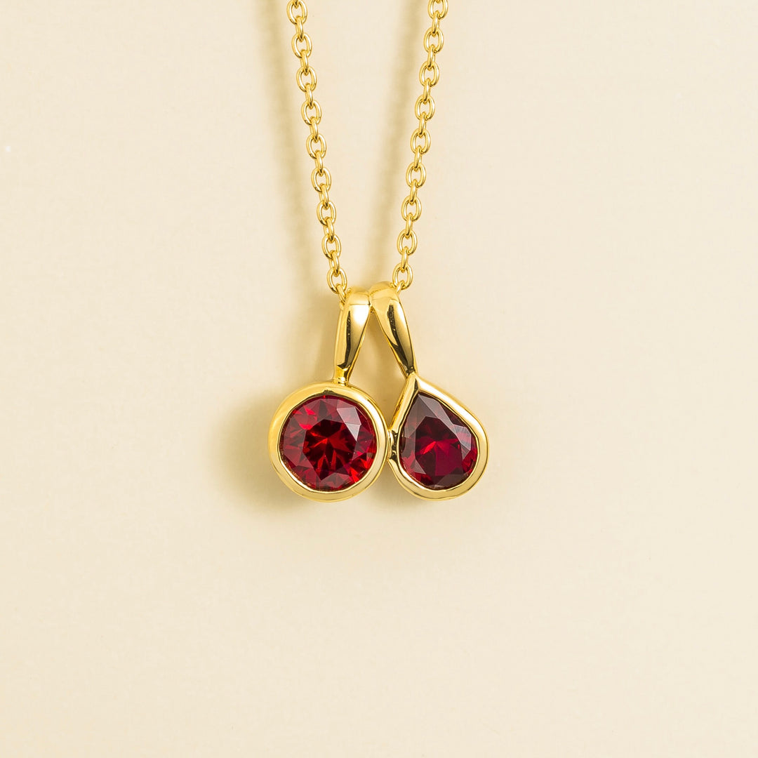 Prunus gold necklace set with Ruby