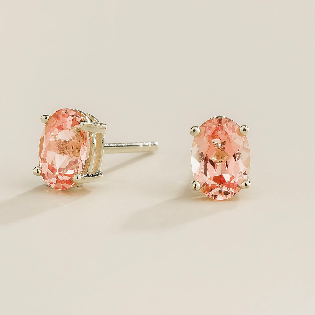 Ovo white gold earrings set with Padparadscha sapphire