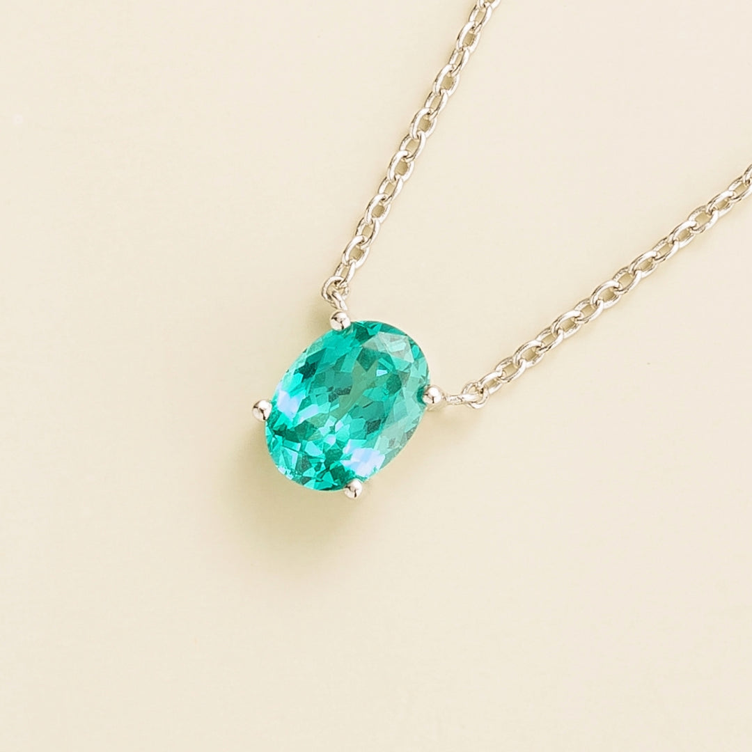 Ovo white gold necklace set with Paraiba sapphire