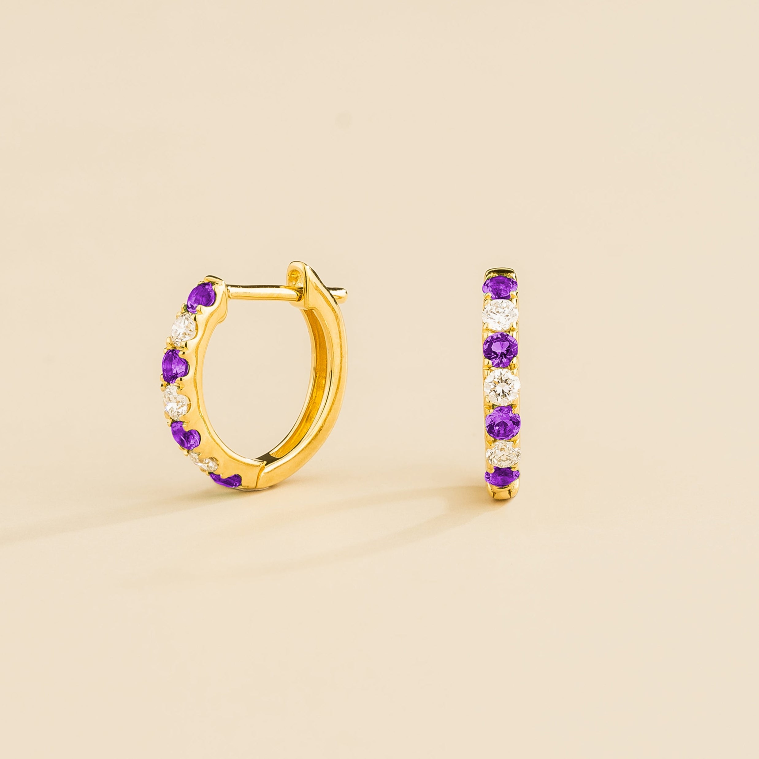 ciclo gold earrings set with purple sapphire and diamond