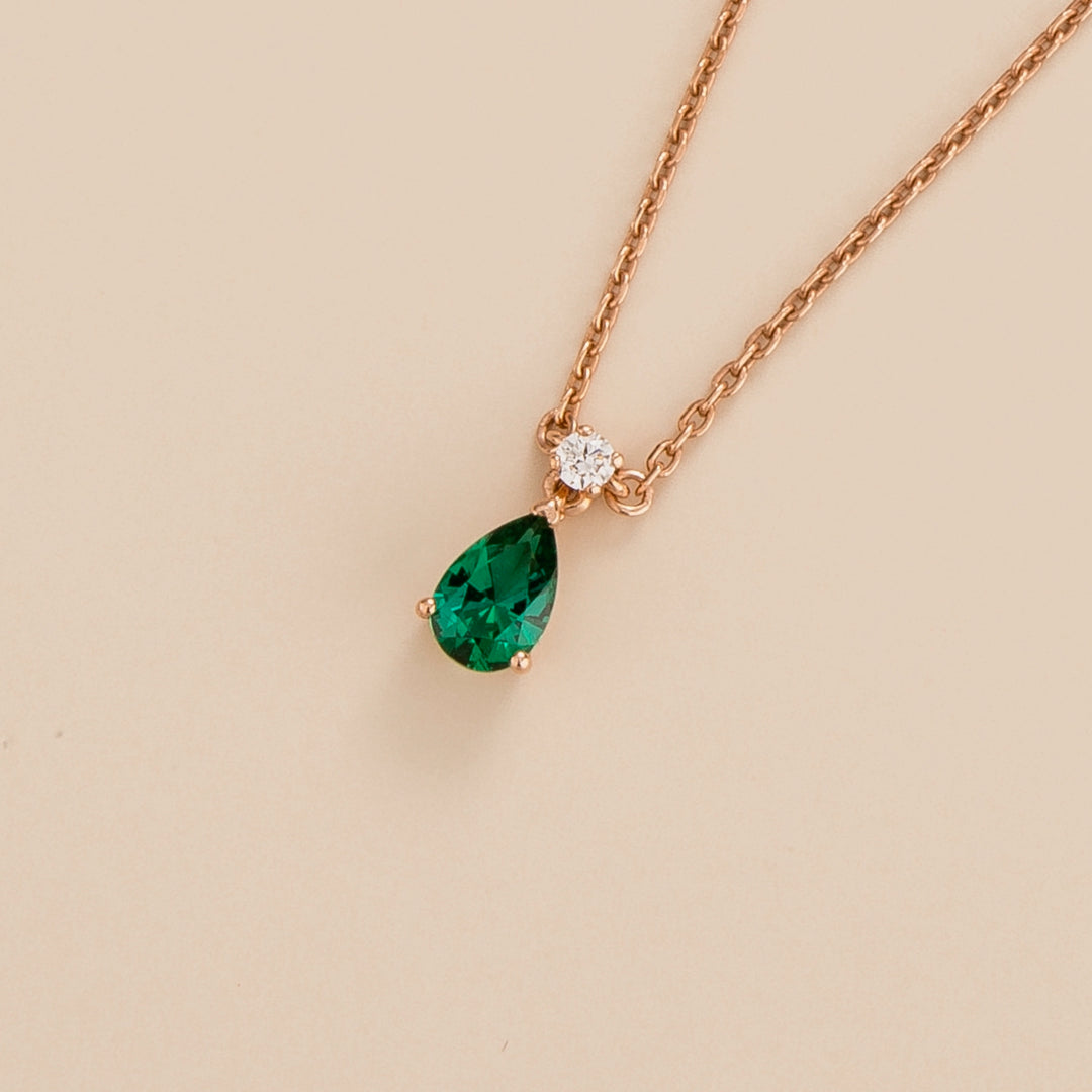 Ori pear drop necklace in 18K pink gold vermeil set with lab grown emerald and diamond gem stones.